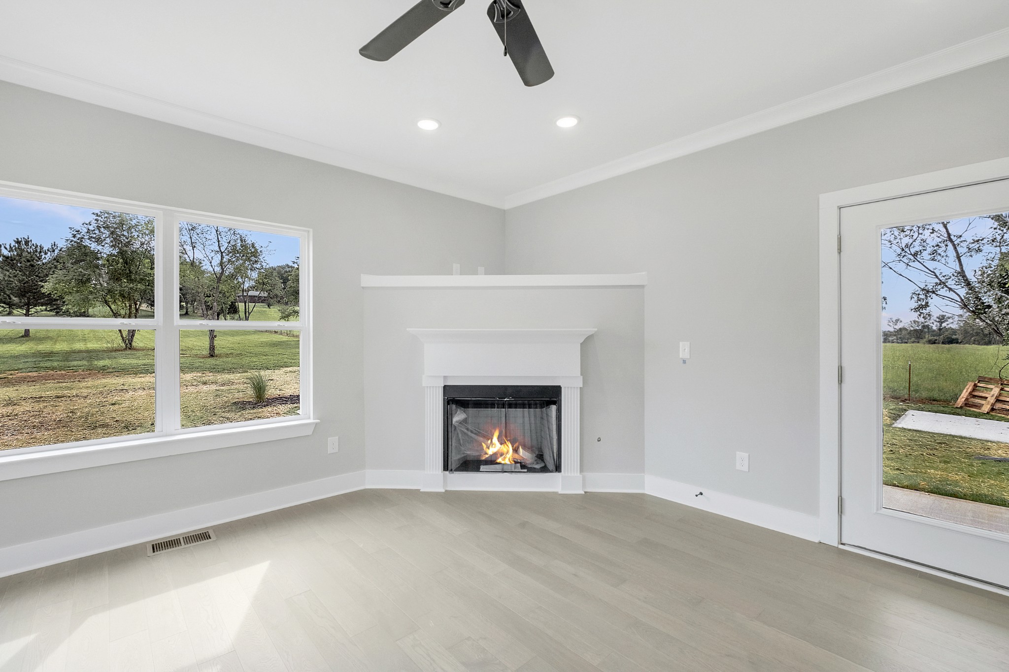 1227 Maple Hill Road Lebanon, TN 37087 - Photo 9 of 43 an empty room with fireplace and window