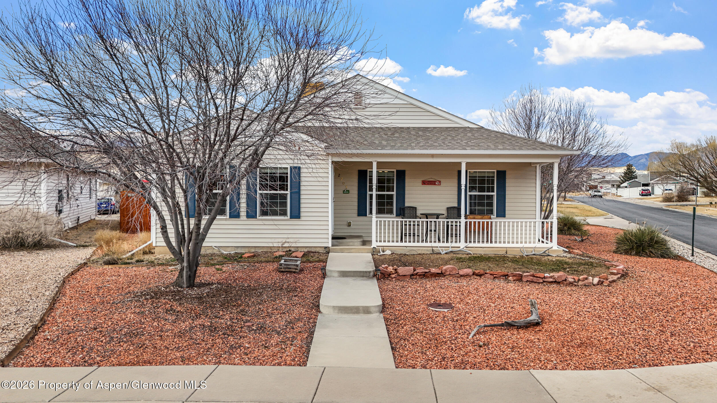 2703 Acacia Court Rifle, CO 81650 - Photo 1 of 29 a front view of a house with garden