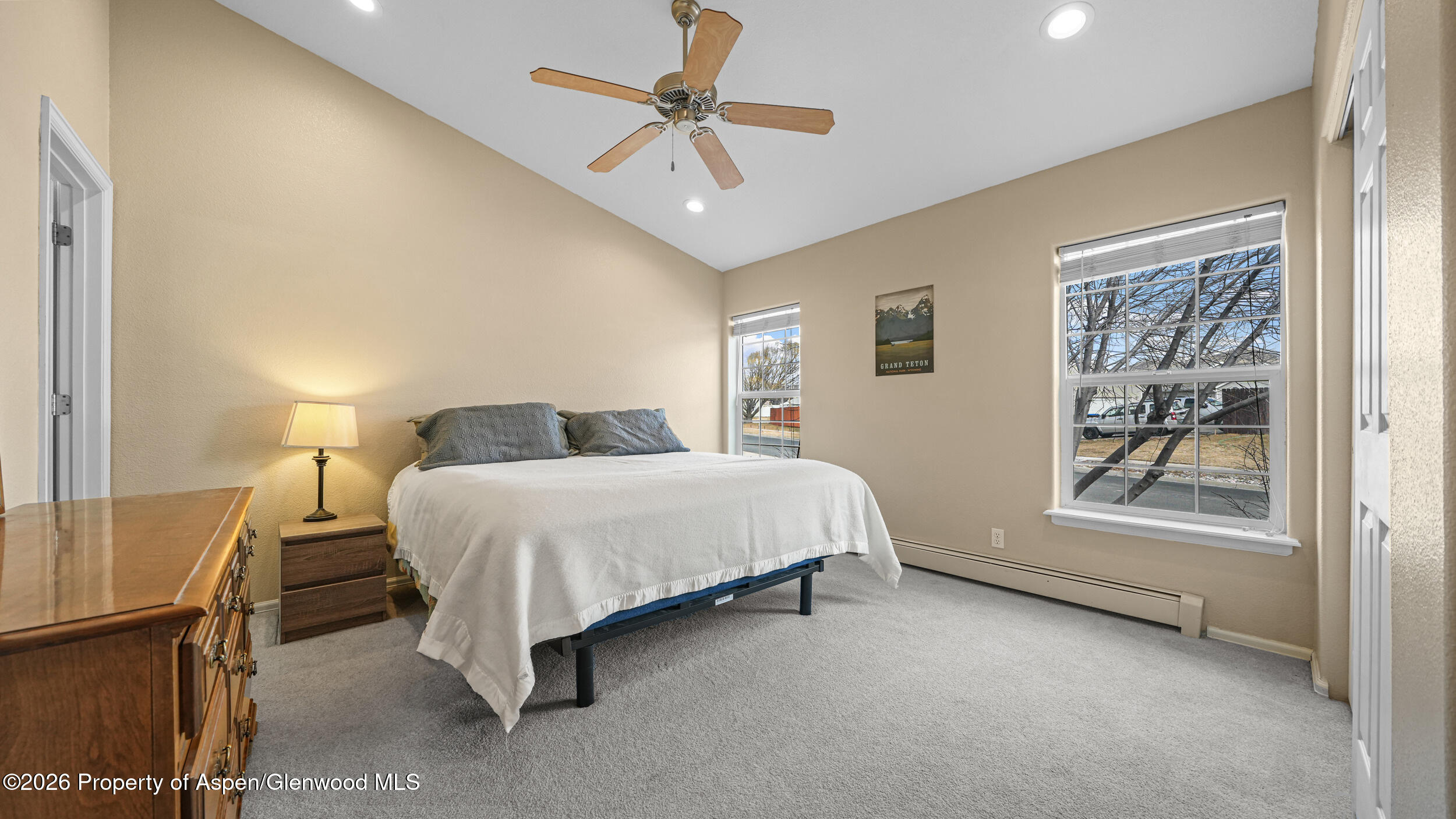 2703 Acacia Court Rifle, CO 81650 - Photo 13 of 29 a bedroom with a bed and a window