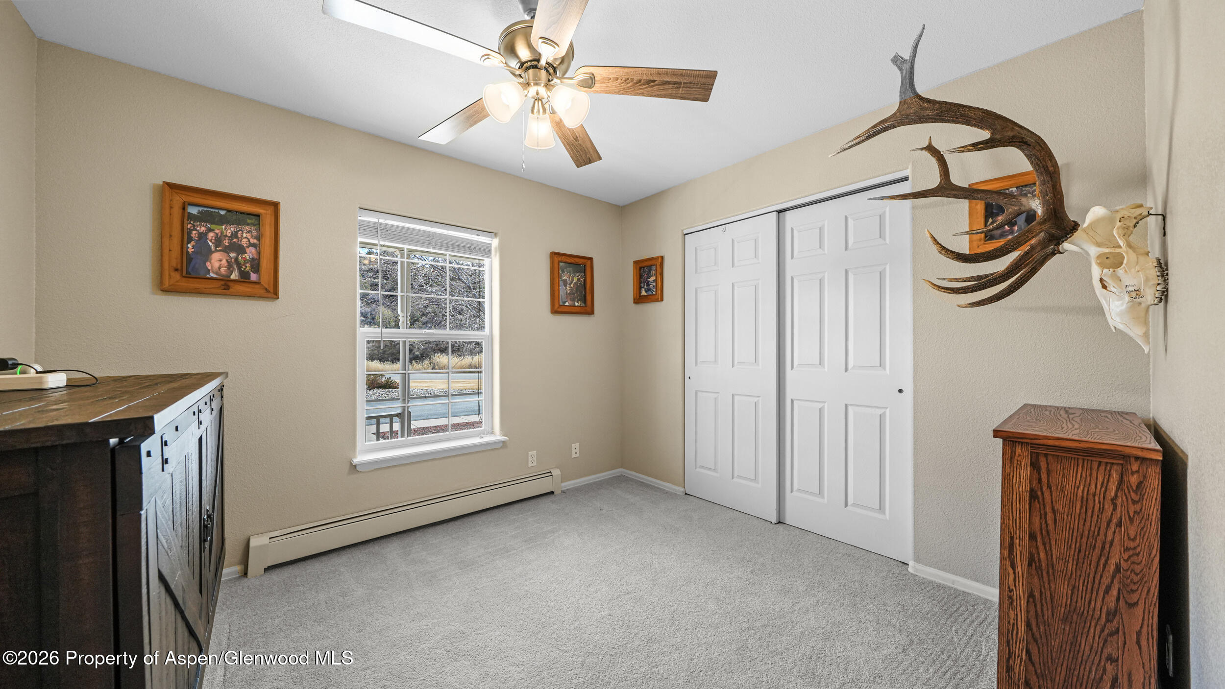 2703 Acacia Court Rifle, CO 81650 - Photo 18 of 29 a view of a livingroom with a fan and a window