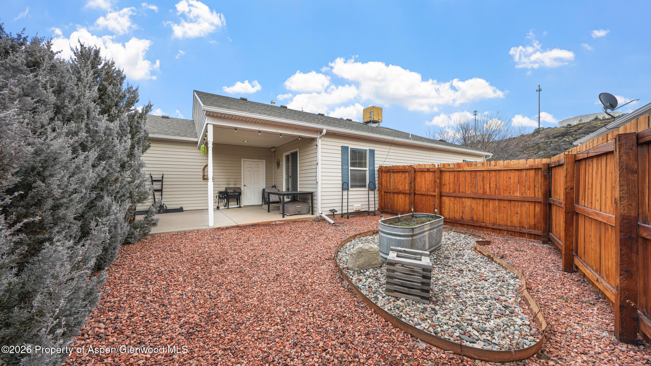 2703 Acacia Court Rifle, CO 81650 - Photo 19 of 29 a view of a porch with a table and chairs