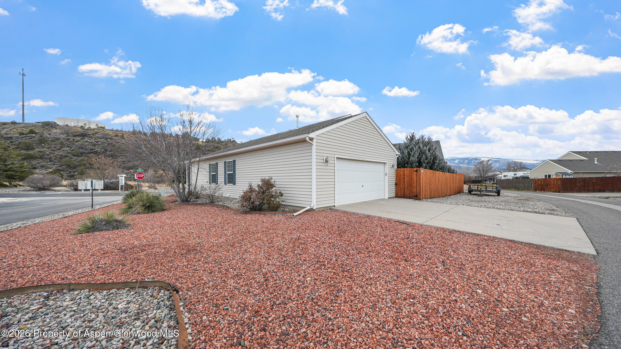 2703 Acacia Court Rifle, CO 81650 - Photo 22 of 29 a very nice looking house with a yard