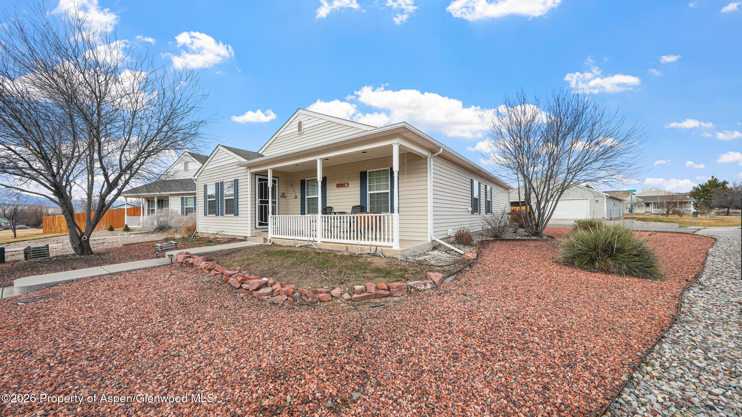 2703 Acacia Court Rifle, CO 81650 - Photo 25 of 29 a view of a house with a yard