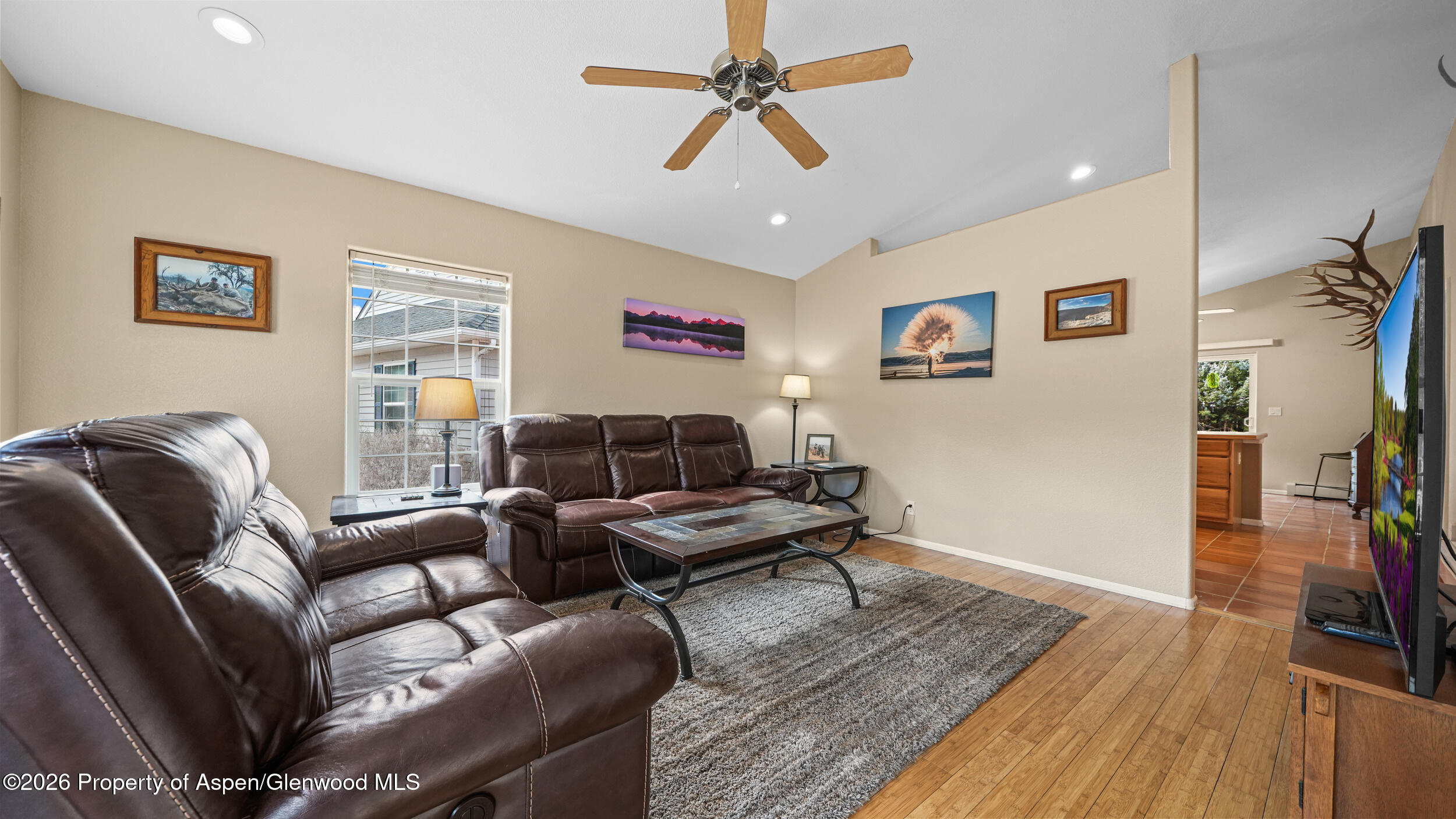 2703 Acacia Court Rifle, CO 81650 - Photo 6 of 29 a living room with furniture and a flat screen tv