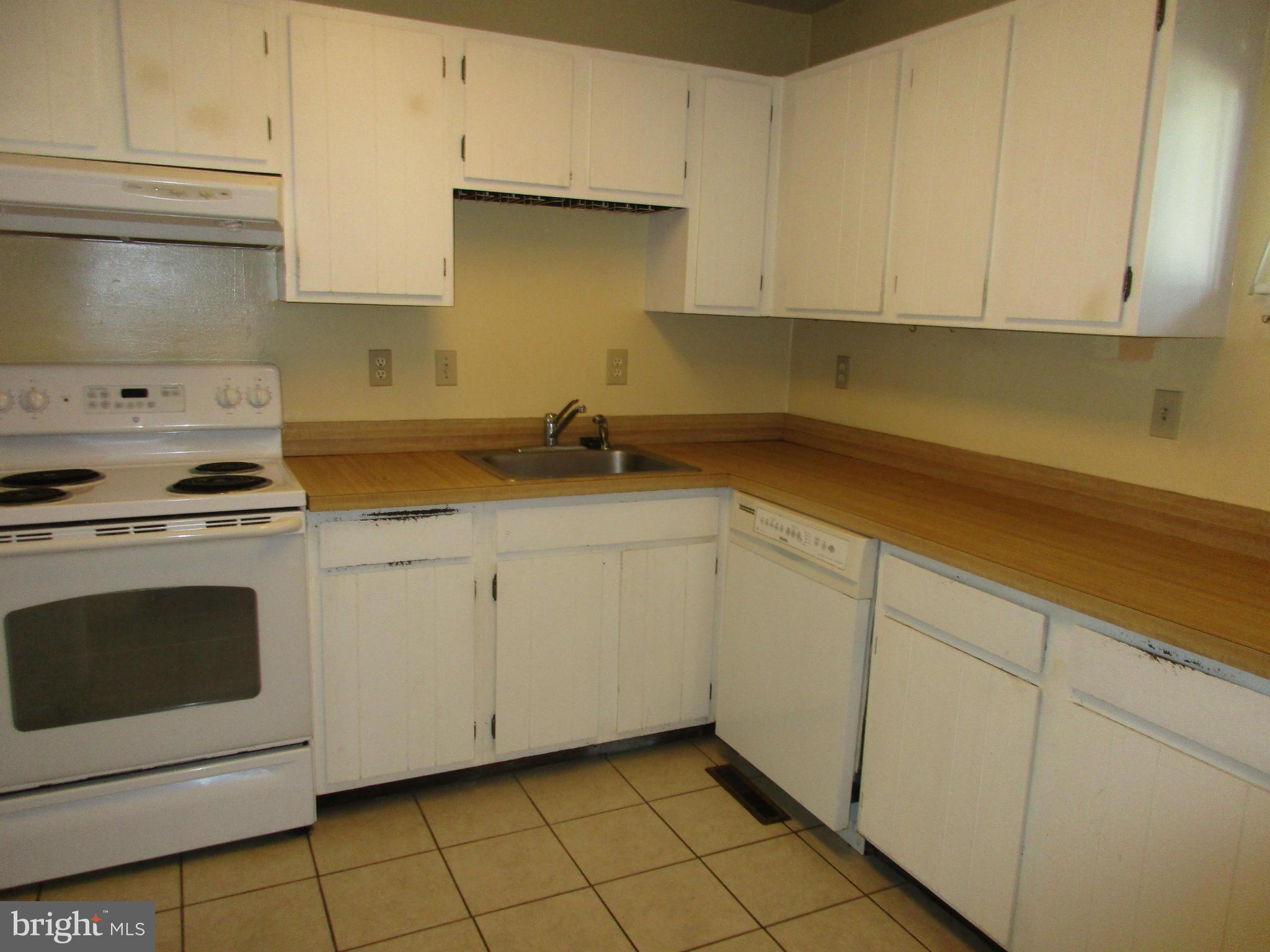 1635 Bay Ridge Road Edgewater, MD 21037 - Photo 4 of 15 a kitchen with granite countertop white cabinets and white appliances
