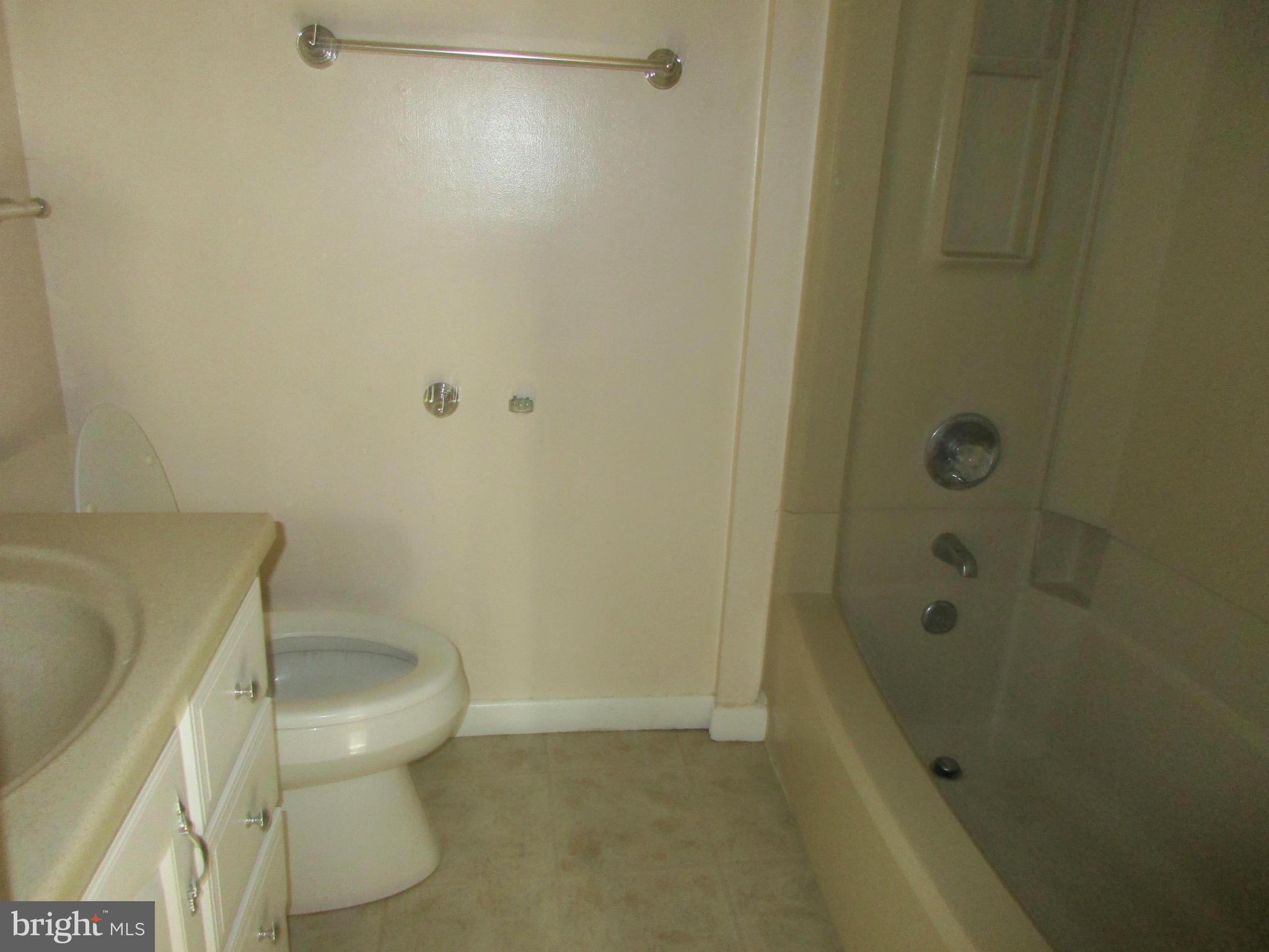 1635 Bay Ridge Road Edgewater, MD 21037 - Photo 10 of 15 a bathroom with a granite countertop bathtub and toilet
