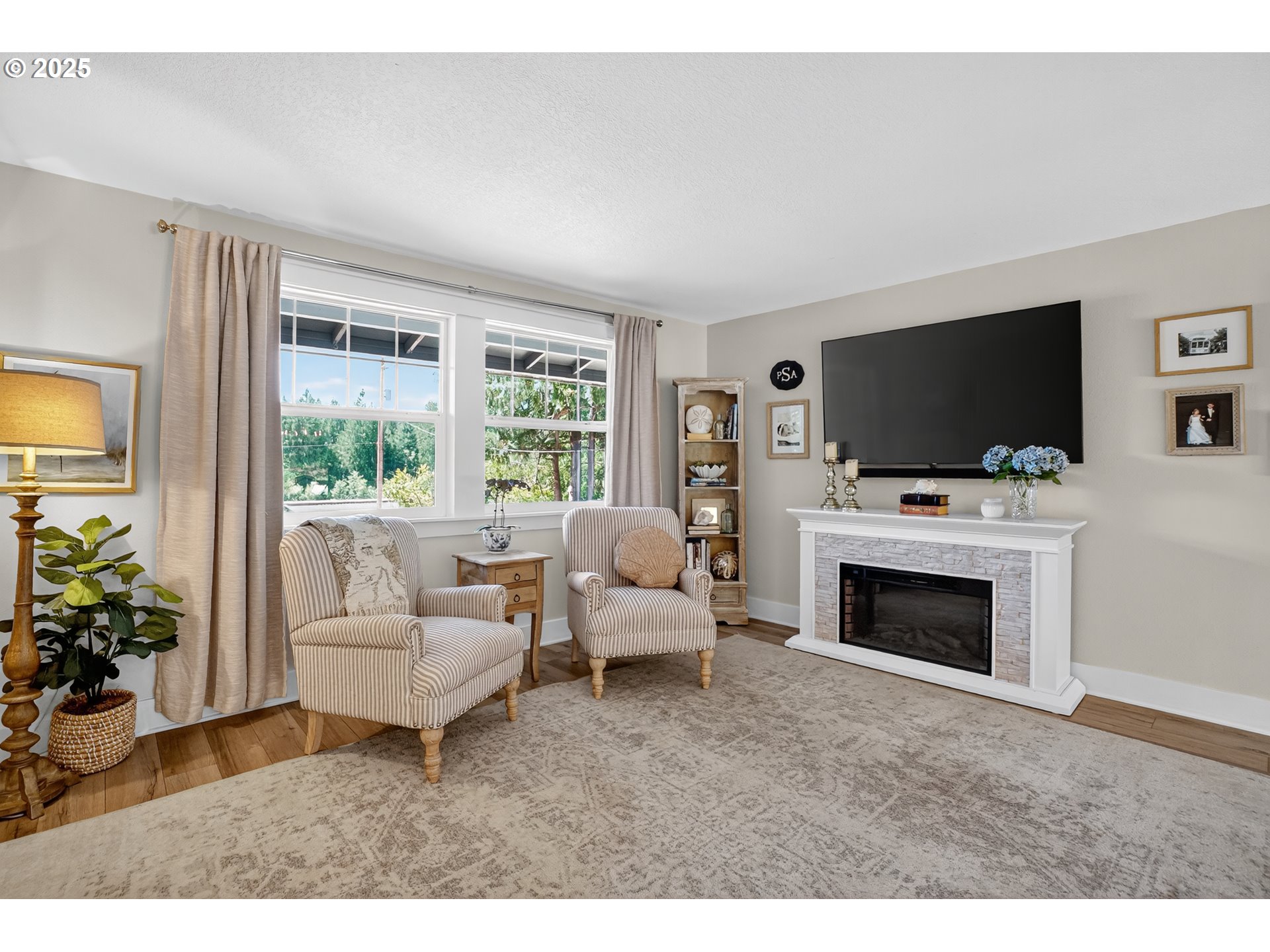 26280 South Beavercreek Road Beavercreek, OR 97004 - Photo 6 of 39 a living room with furniture a fireplace and a flat screen tv