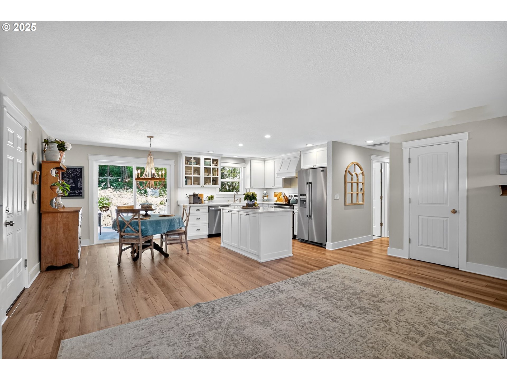 26280 South Beavercreek Road Beavercreek, OR 97004 - Photo 7 of 39 a view of a living room and kitchen with furniture and wooden floor