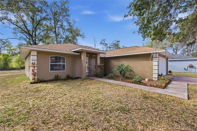 a house with trees in the background