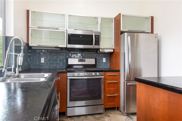 a view of a balcony with table and chairs