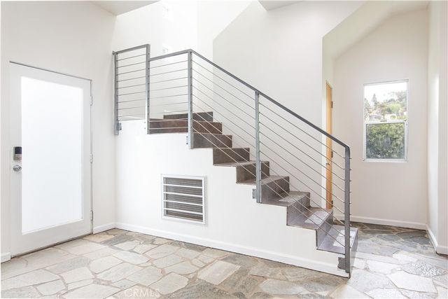 a view of a balcony with furniture
