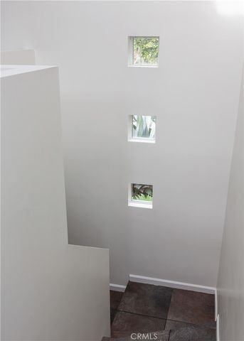 a view of a balcony with table and chairs