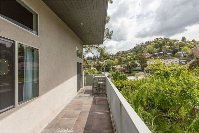 a room with wooden cabinets and a window