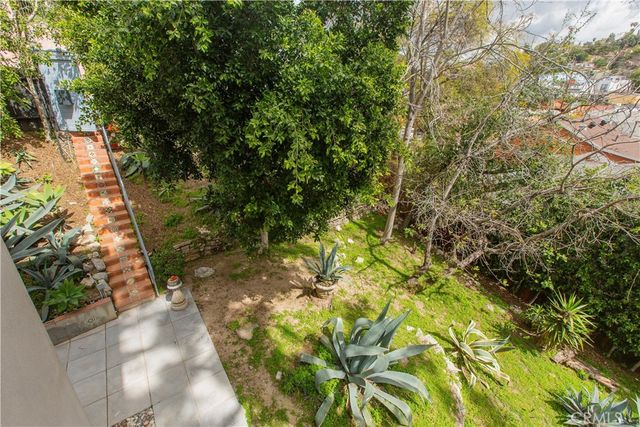 a bathroom with a toilet a sink and a mirror