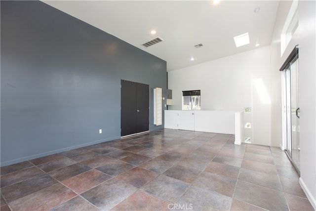 a bathroom with a granite countertop sink and mirror