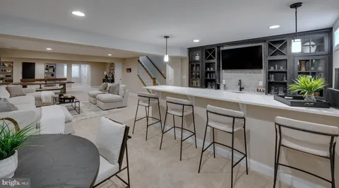 a very nice looking living room with furniture and a flat screen tv