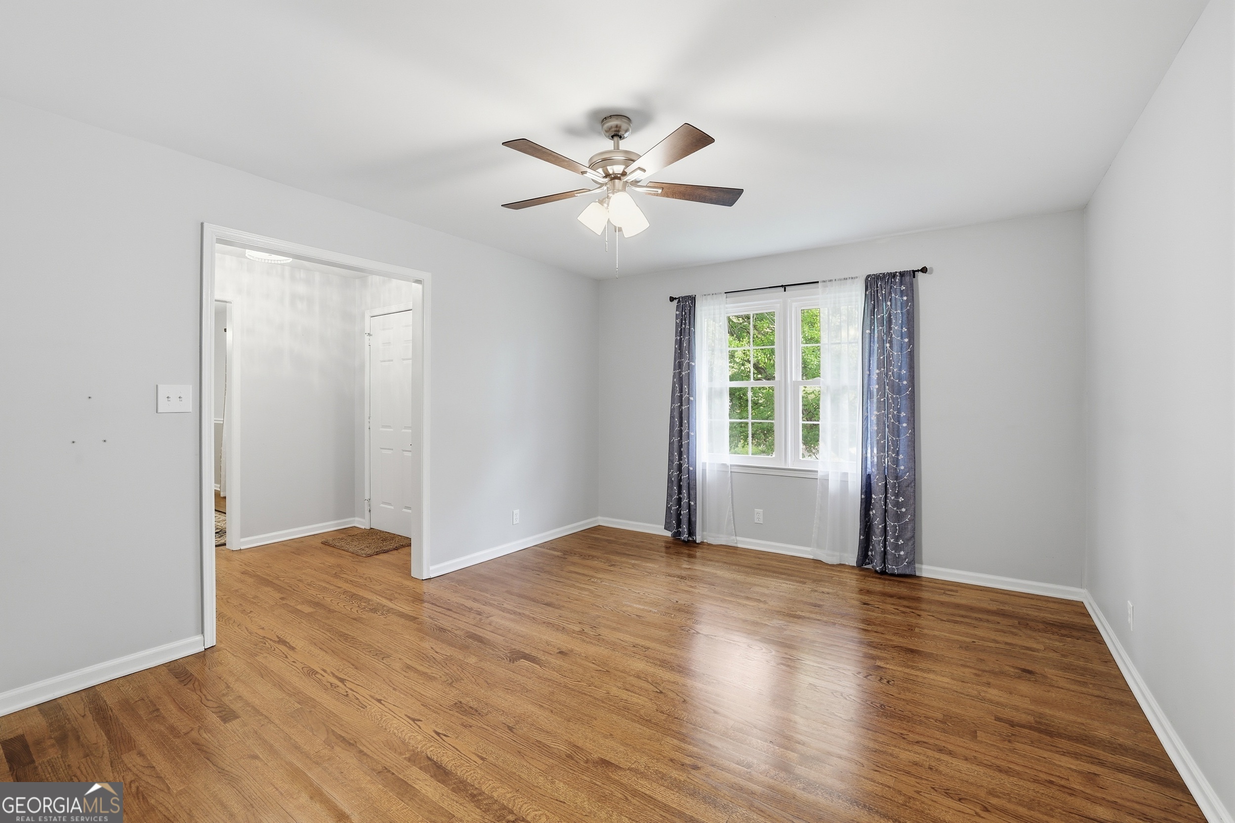 23 Cane Brake Circle Toccoa, GA 30577 - Photo 11 of 35 a view of an empty room with window and wooden floor