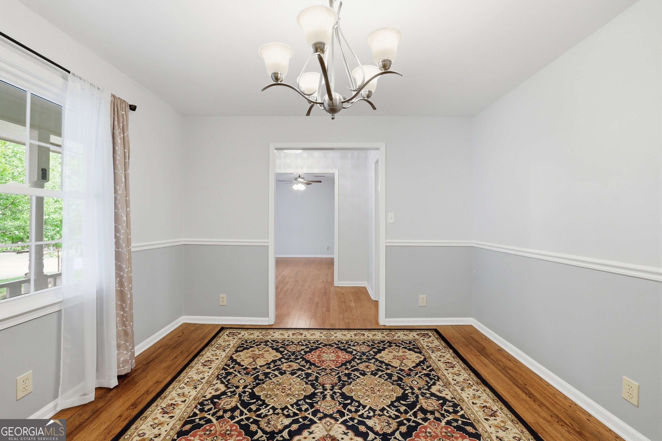 23 Cane Brake Circle Toccoa, GA 30577 - Photo 12 of 35 a view of a hallway with wooden floor and a chandelier