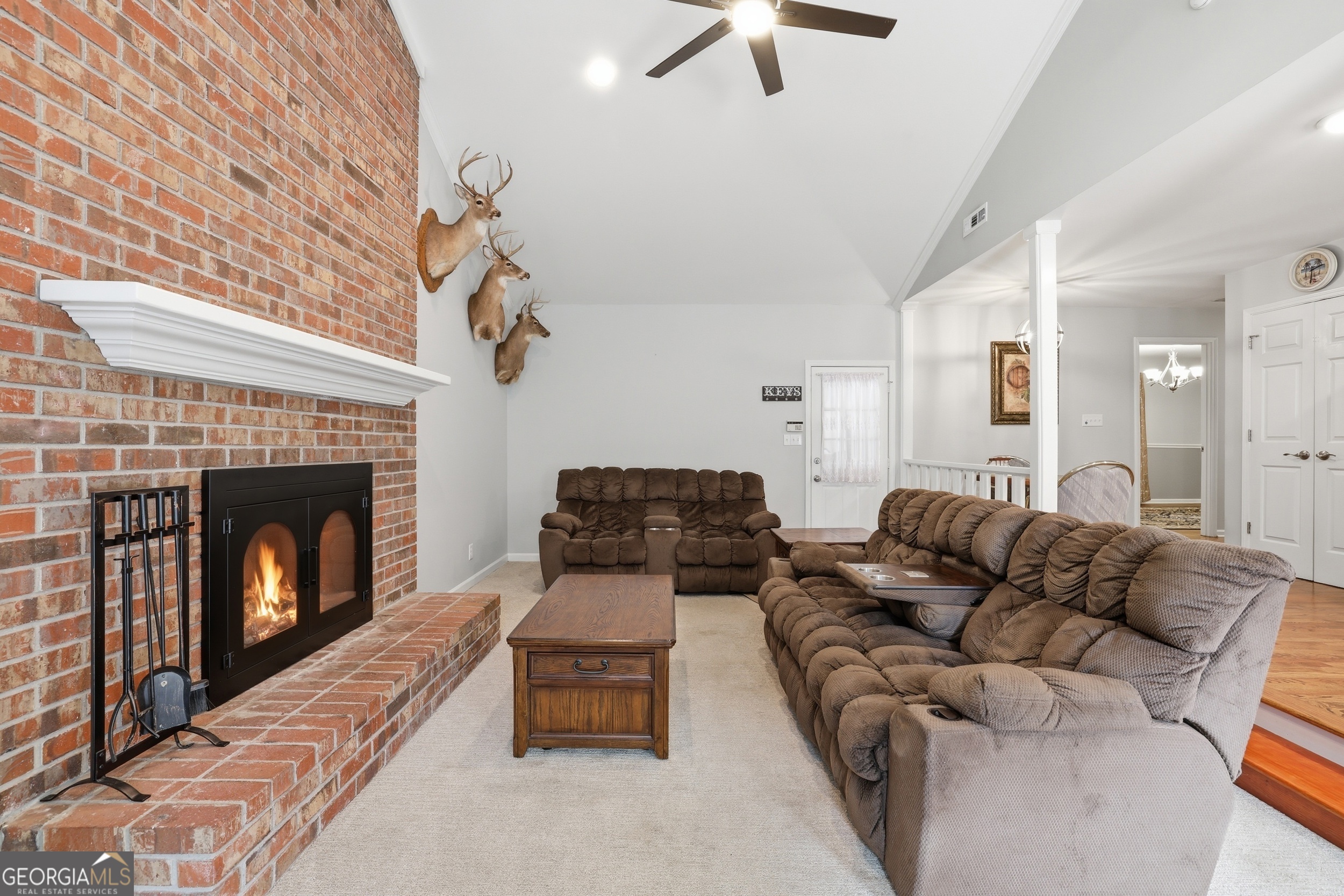 23 Cane Brake Circle Toccoa, GA 30577 - Photo 16 of 35 a living room with furniture a fireplace and a chandelier