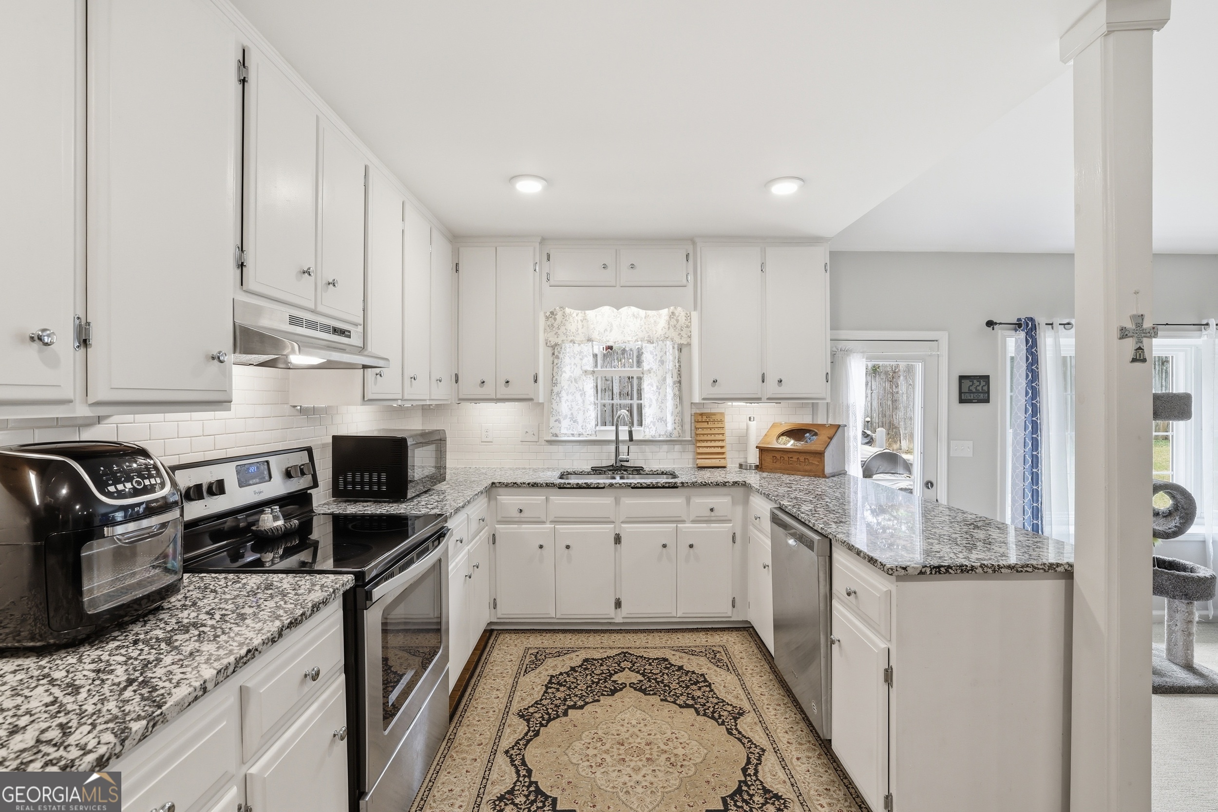 23 Cane Brake Circle Toccoa, GA 30577 - Photo 19 of 35 a kitchen with stainless steel appliances granite countertop a sink stove refrigerator and cabinets
