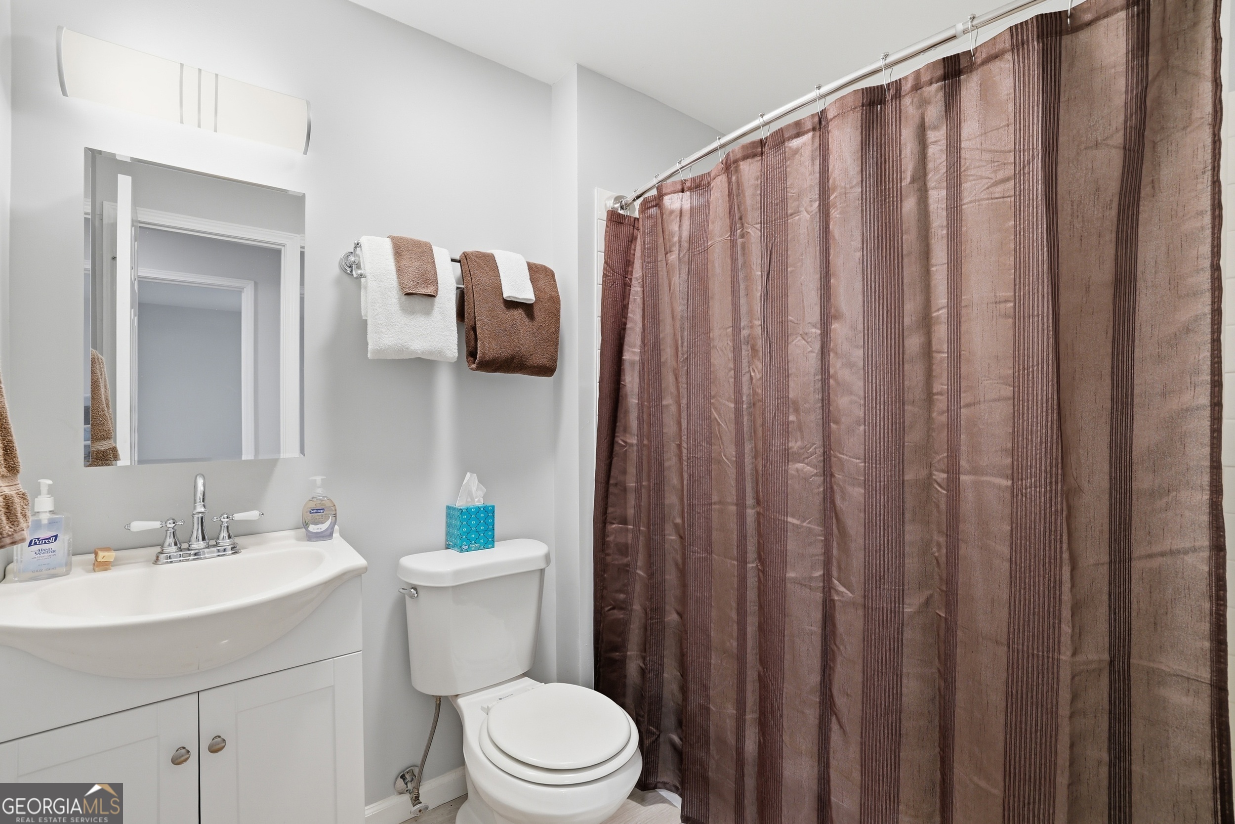 23 Cane Brake Circle Toccoa, GA 30577 - Photo 23 of 35 a bathroom with a sink a toilet and shower curtain