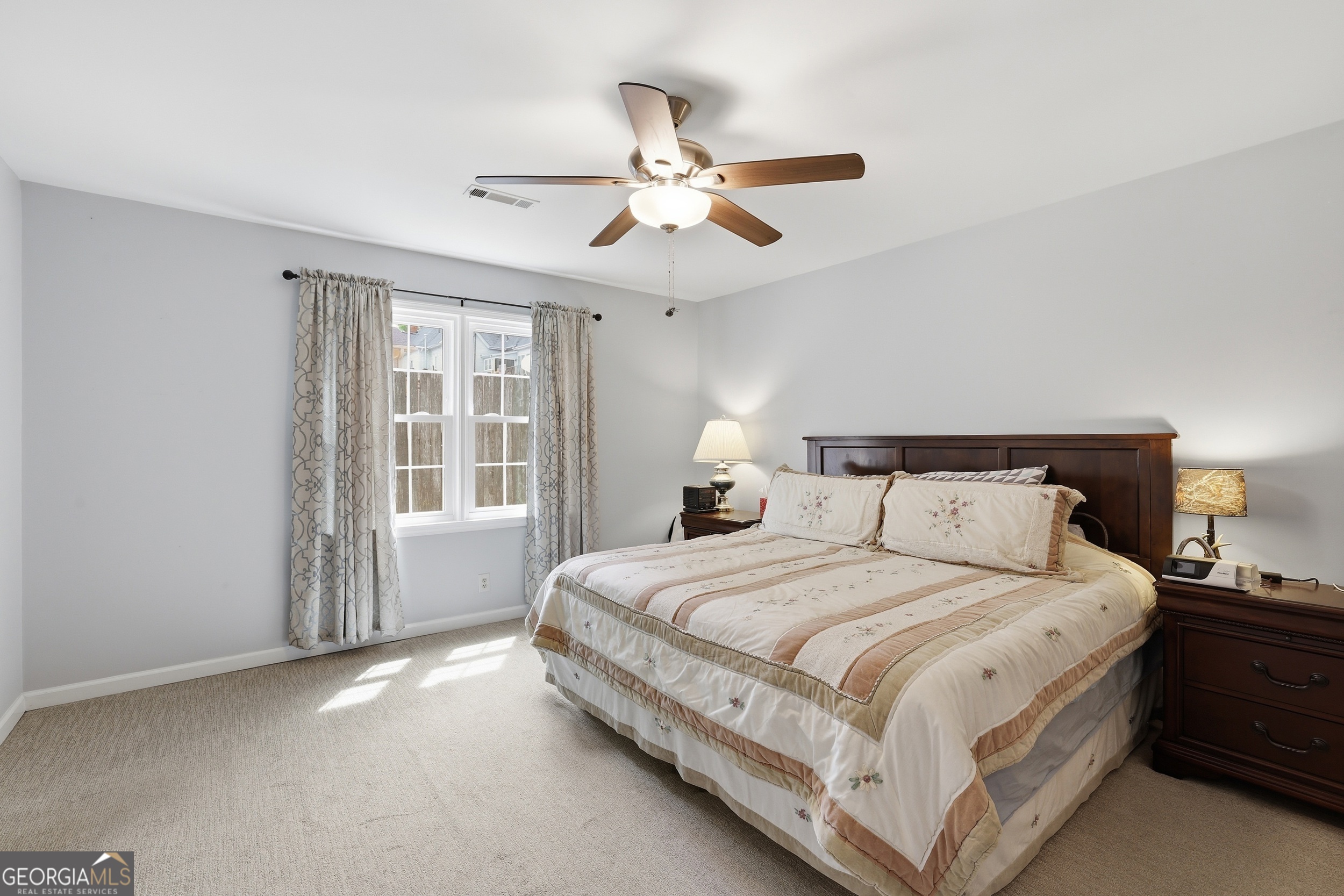 23 Cane Brake Circle Toccoa, GA 30577 - Photo 27 of 35 a bedroom with a large bed and a chandelier fan
