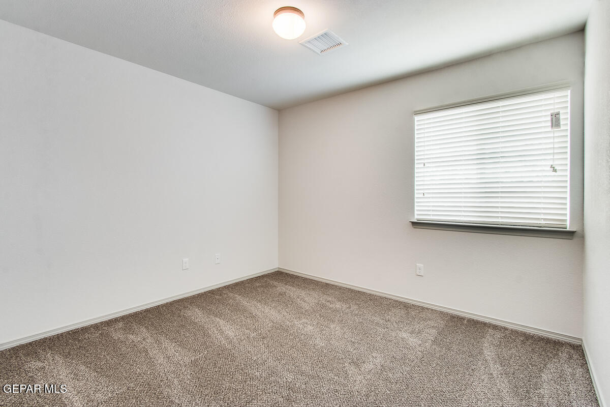 12420 Oconee Place Clint, TX 79836 - Photo 22 of 27 an empty room with a window
