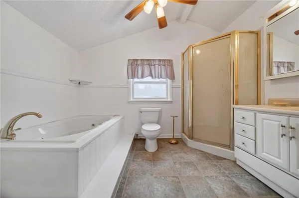 a white toilet sitting next to a bathroom sink
