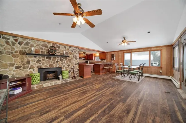 a dining room with furniture window and wooden floor