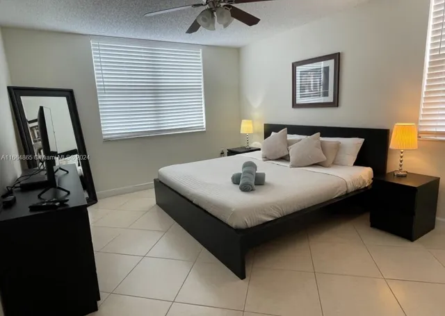 a bedroom with a bed and dresser