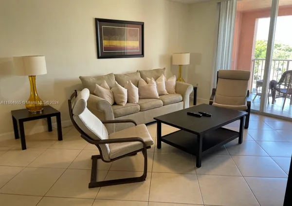 a living room with furniture and a table