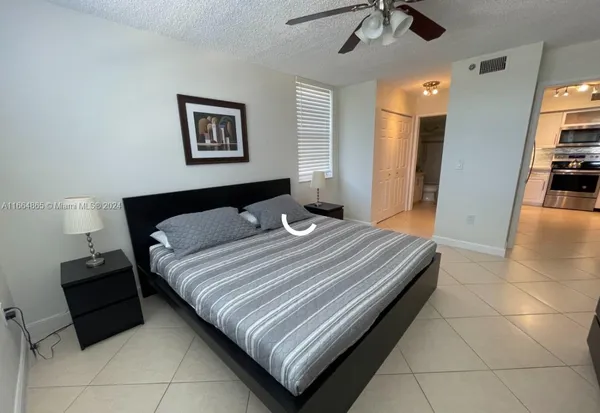 a bedroom with a bed and a walk in closet