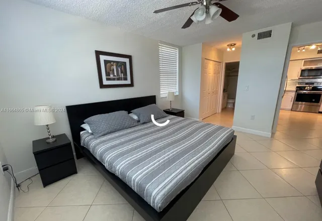 a bedroom with a bed and a walk in closet