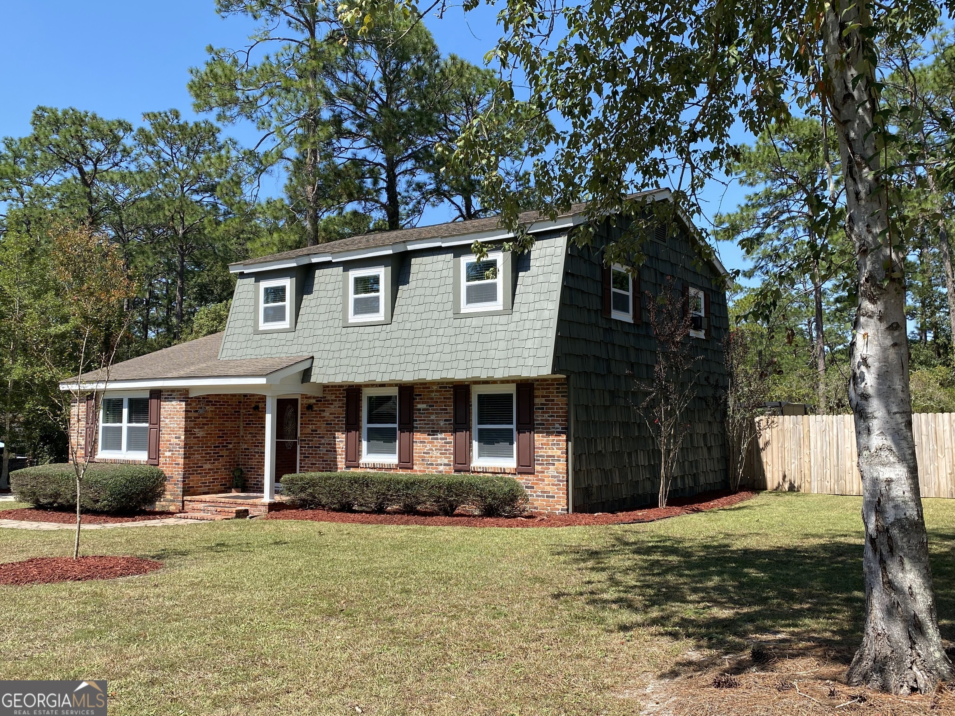 118 Poplar Trail Southwest Moultrie, GA 31768 - Photo 1 of 1 a front view of a house with a garden