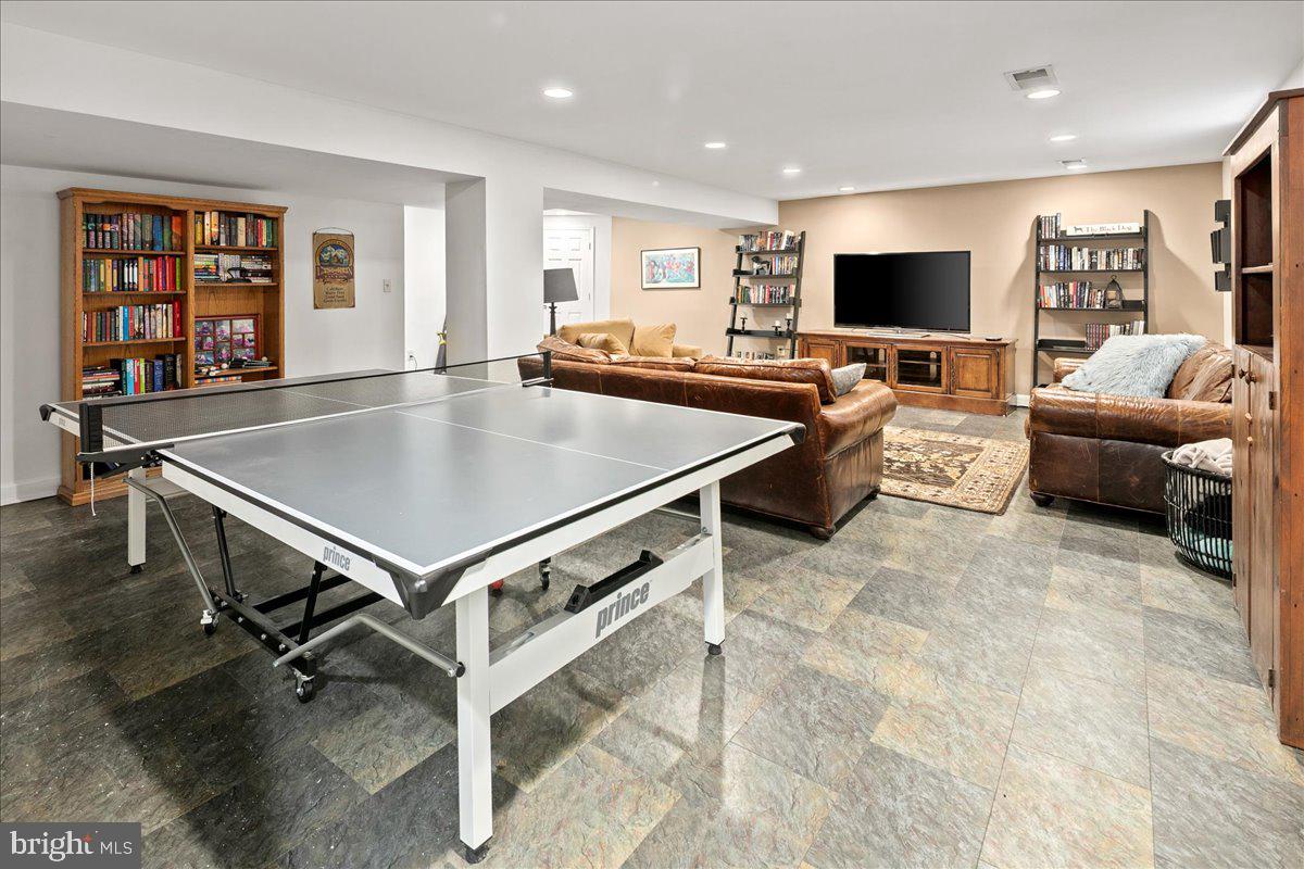 3012 Russell Road Alexandria, VA 22305 - Photo 47 of 56 a living room with stainless steel appliances furniture and a flat screen tv