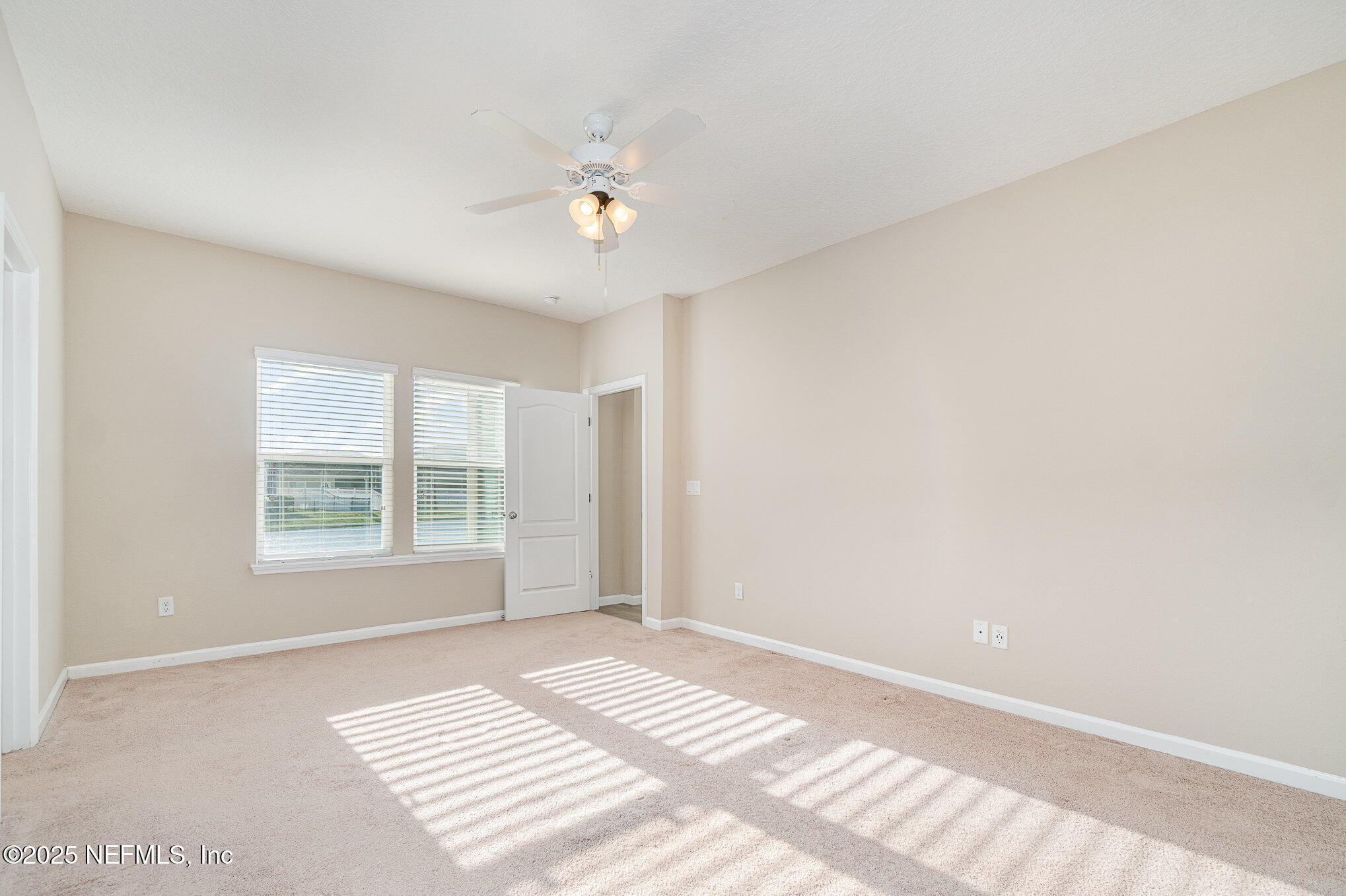 4220 Arbor Mill Circle Orange Park, FL 32065 - Photo 12 of 23 a view of an empty room with a window