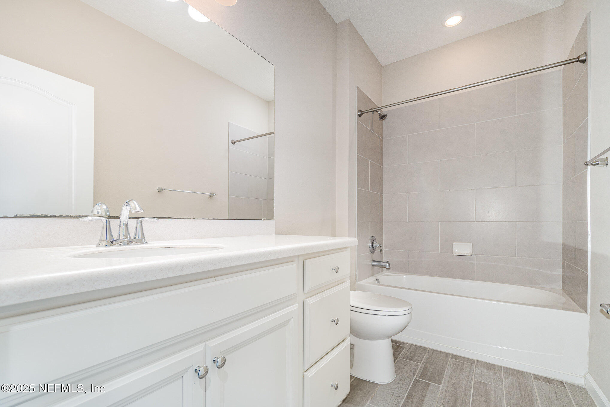 4220 Arbor Mill Circle Orange Park, FL 32065 - Photo 20 of 23 a bathroom with a granite countertop sink toilet a shower and a mirror