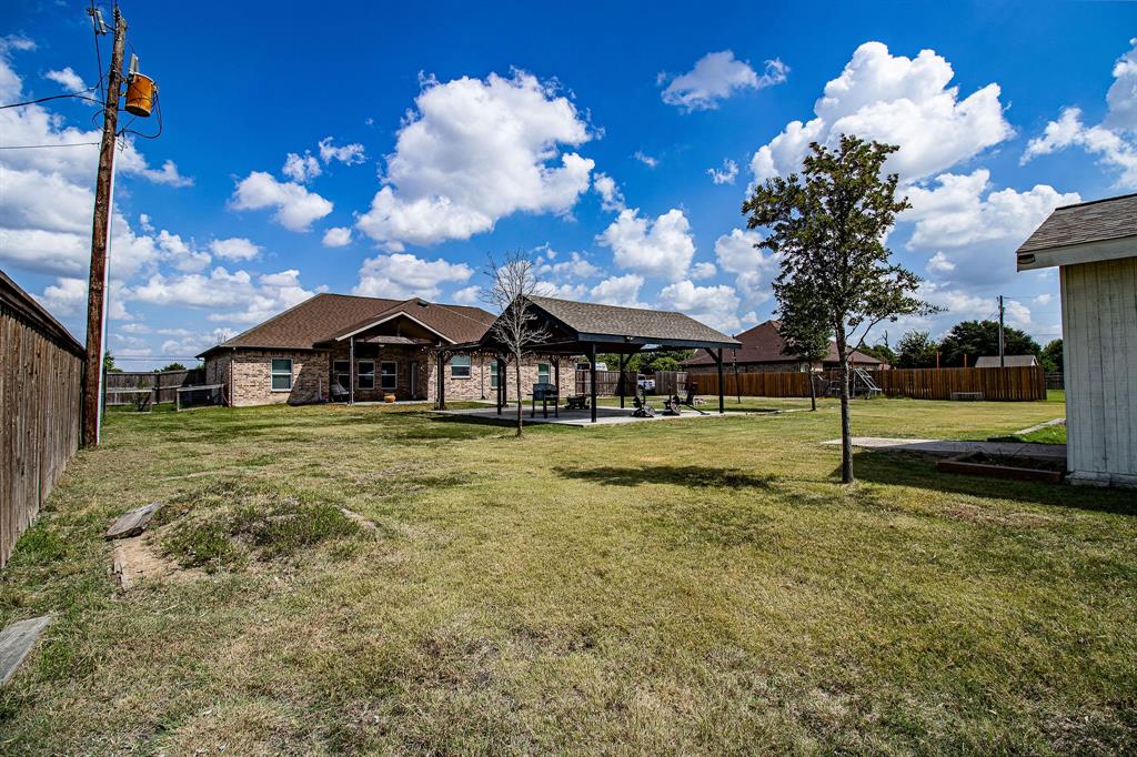 328 Meadow Lane Red Oak, TX 75154 - Photo 34 of 35 Back of house with a fenced backyard, a patio, and brick siding