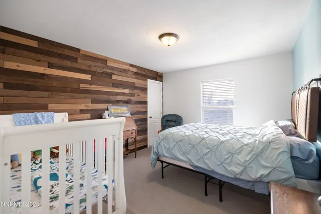 a bathroom with double sink and two mirror