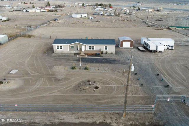 a view of a terrace with a table and chairs