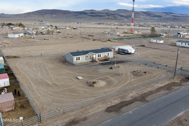 a view of a white house in the middle of a city