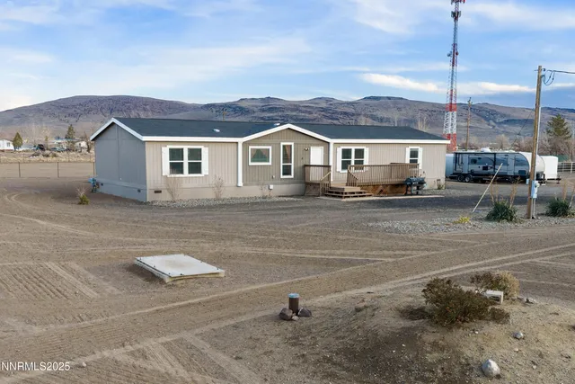 a view of multiple houses with a yard