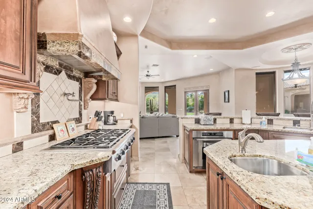 a view of a dining room with furniture and a chandelier