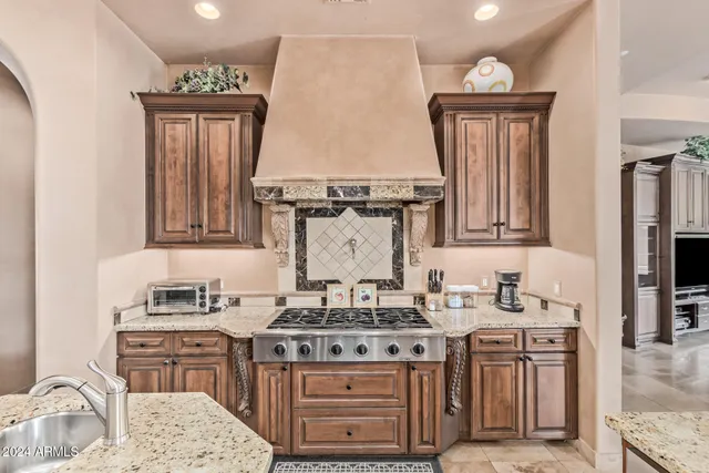 a living room with furniture a fireplace and a potted plant