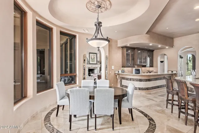 a living room with a couch and a potted plant