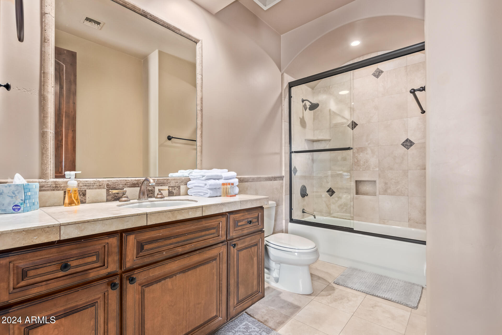 5339 East Royal Palm Road Paradise Valley, AZ 85253 - Photo 39 of 95 a bathroom with a double vanity sink toilet mirror and shower