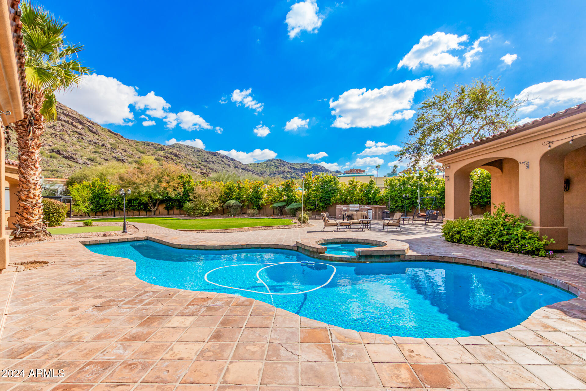 5339 East Royal Palm Road Paradise Valley, AZ 85253 - Photo 4 of 95 a view of a swimming pool with an outdoor seating space