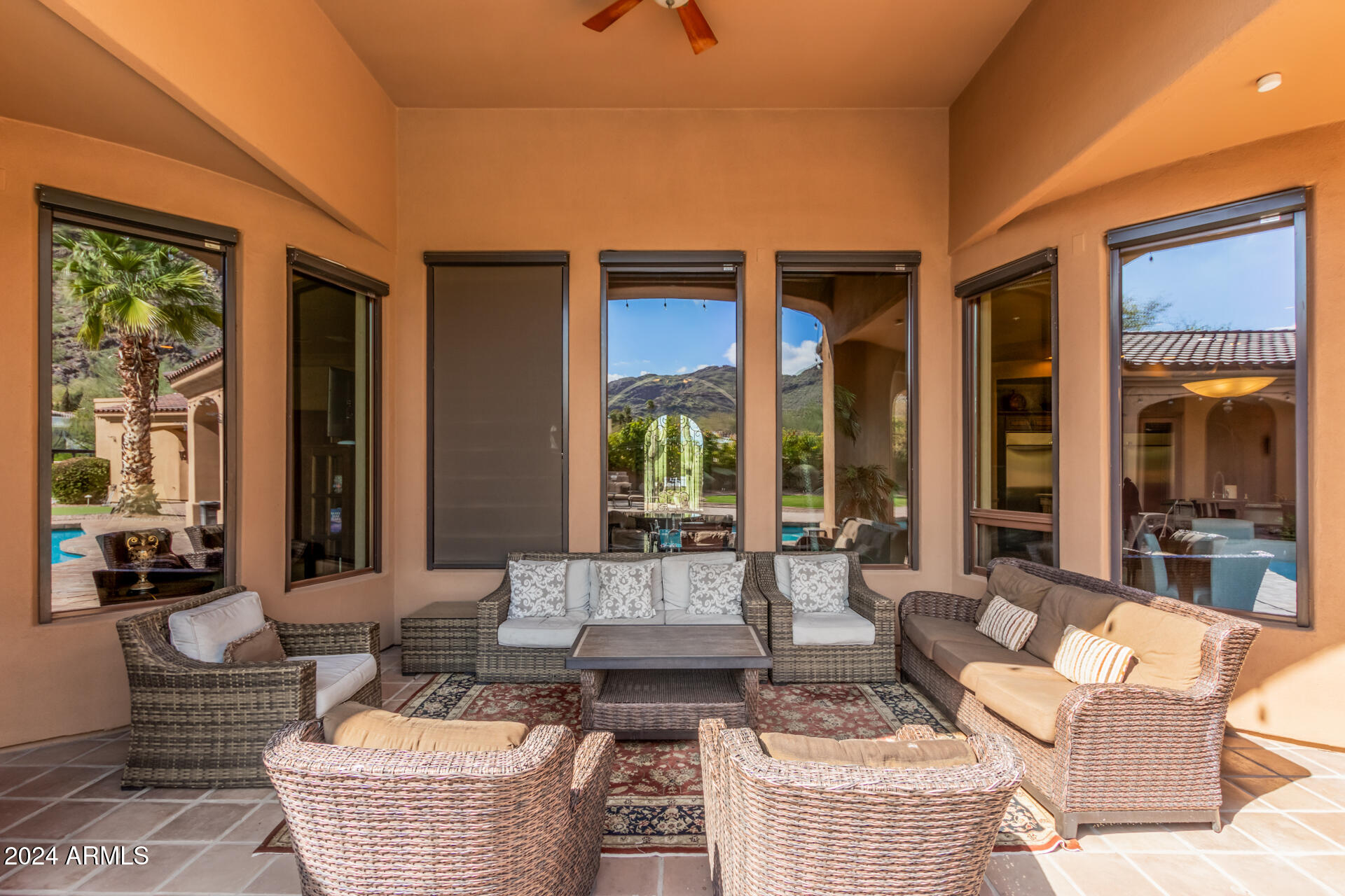 5339 East Royal Palm Road Paradise Valley, AZ 85253 - Photo 45 of 95 a living room with furniture and large windows