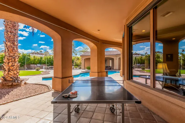 a view of a swimming pool with a patio
