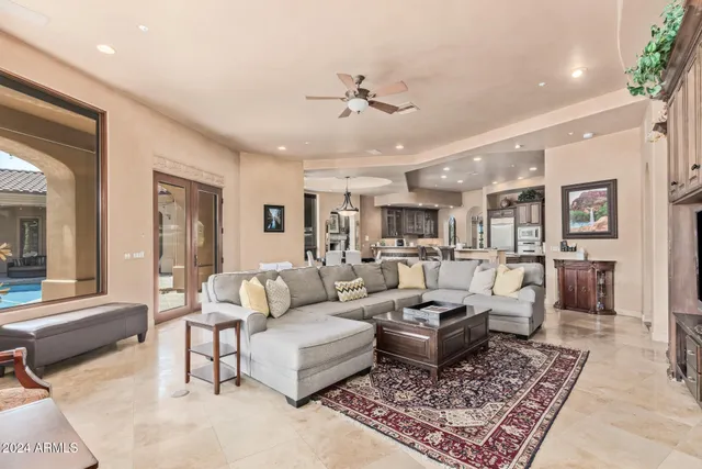 a kitchen with granite countertop a sink stove and cabinets